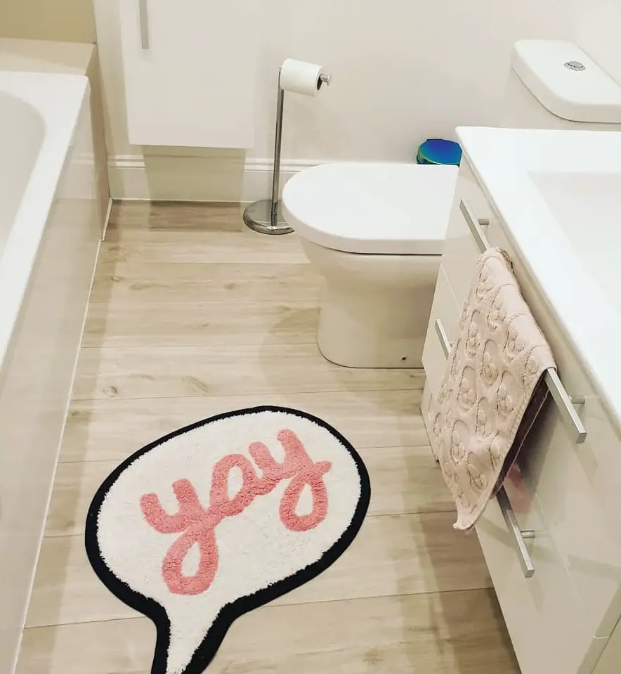 Yay Rug and Skull in White Bathroom Clean