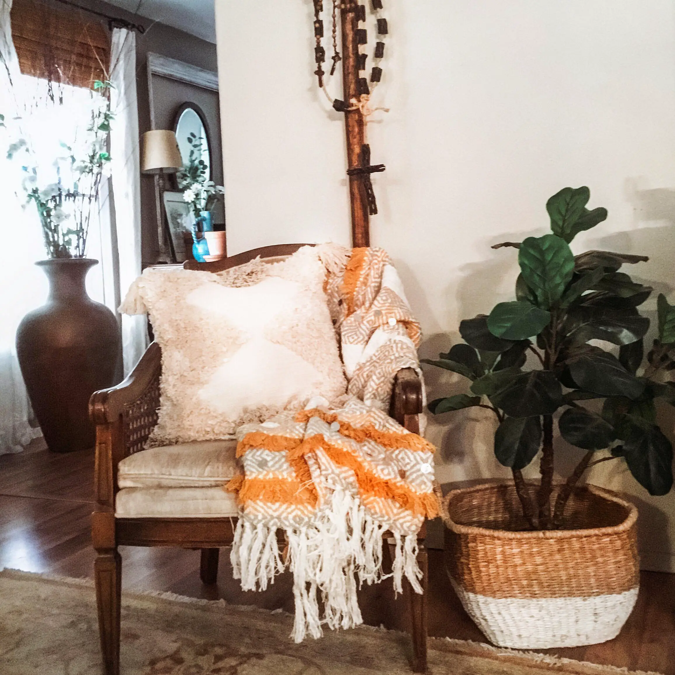 Boho Chair with Throw Blanket and Plant