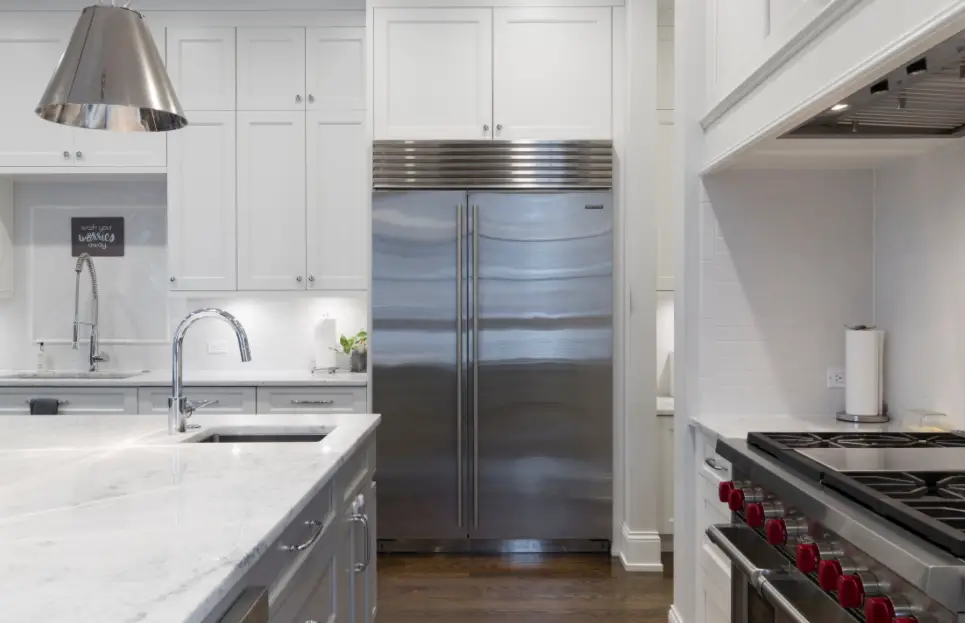 Silver Fridge In White Kitchen 